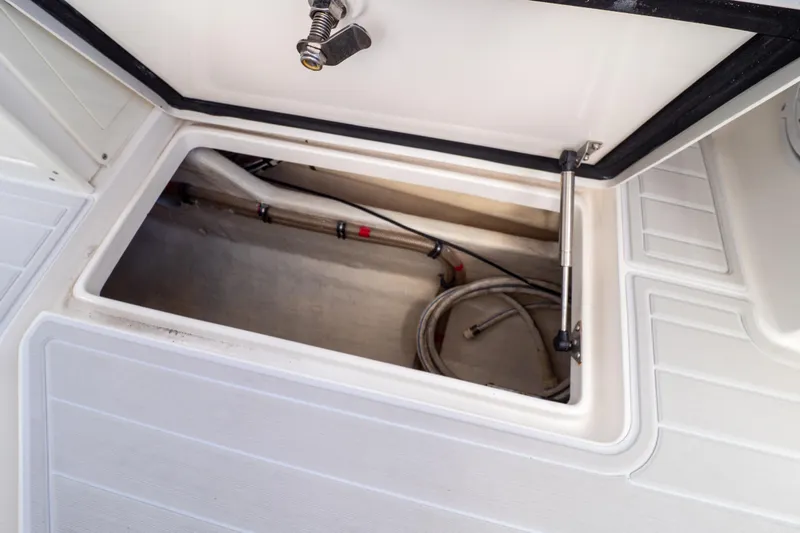  Yacht Photos Pics Open storage compartment on a 2007 Intrepid 350 WA boat deck.