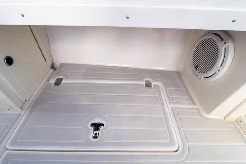  Yacht Photos Pics 2007 Intrepid 350 WA boat interior with storage compartment and speaker.