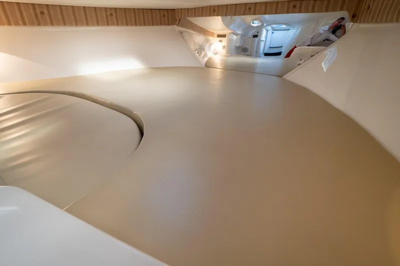  Yacht Photos Pics 2007 Intrepid 350 WA cabin interior with beige upholstery and modern design.