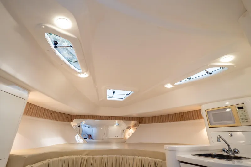  Yacht Photos Pics Interior of 2007 Intrepid 350 WA boat with modern amenities and lighting.