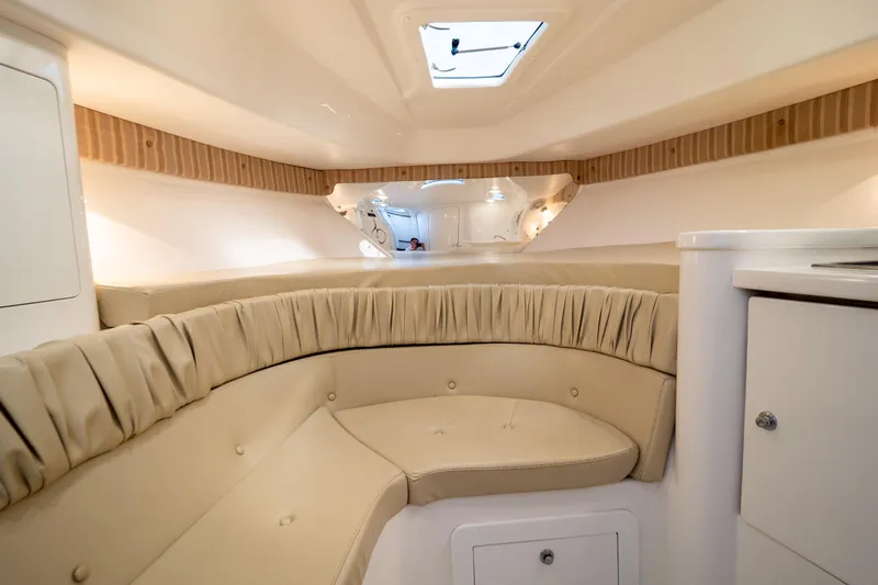  Yacht Photos Pics Luxurious interior of 2007 Intrepid 350 WA boat with beige seating and modern design.