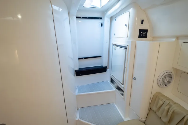  Yacht Photos Pics 2007 Intrepid 350 WA cabin interior with seating, storage, and skylight.