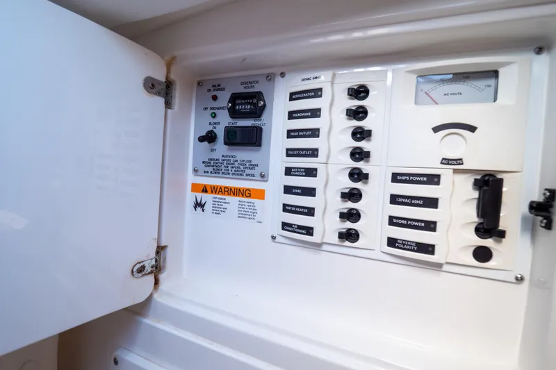  Yacht Photos Pics Electrical control panel inside a 2007 Intrepid 350 WA boat, featuring various switches and warnings.