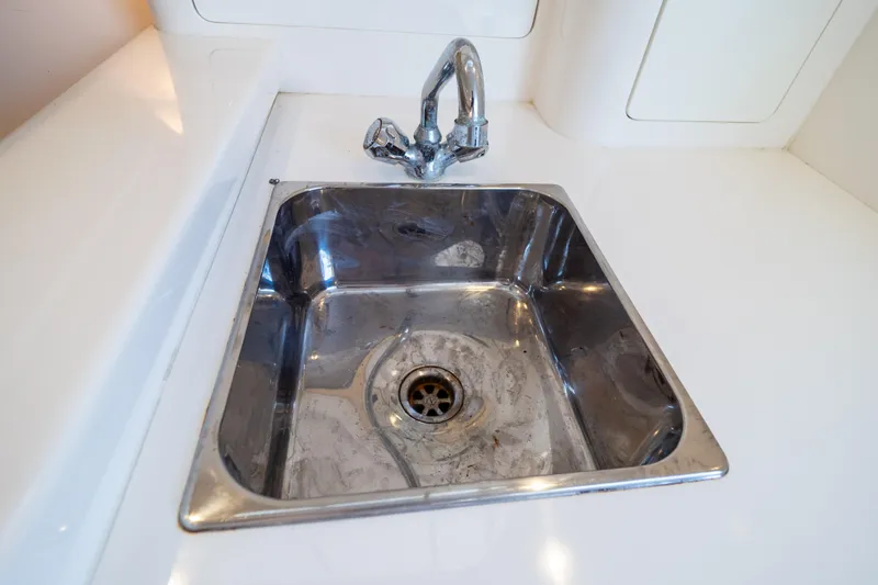  Yacht Photos Pics Stainless steel sink on 2007 Intrepid 350 WA boat, featuring a modern faucet.