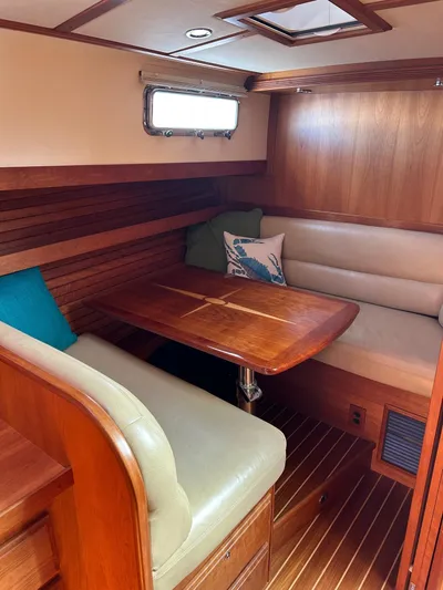 Limbo Yacht Photos Pics 2010 Sabre 40 Sedan interior with wood finish and cozy seating area.