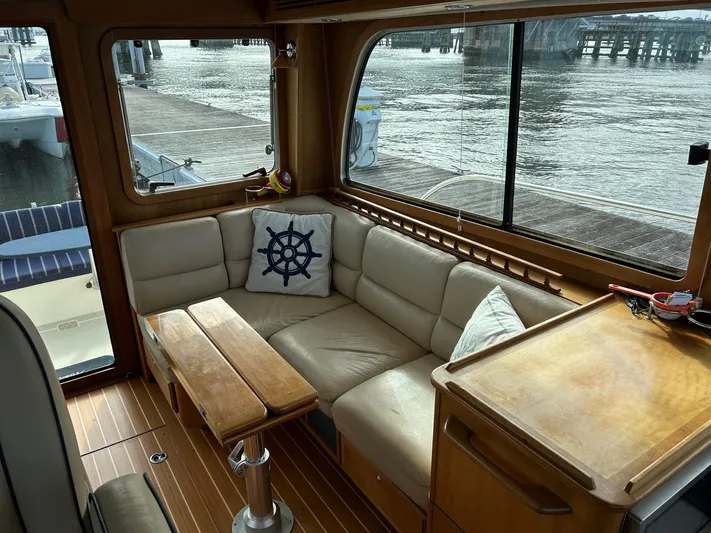 Limbo Yacht Photos Pics Interior of 2010 Sabre 40 Sedan yacht with cozy seating and nautical decor.