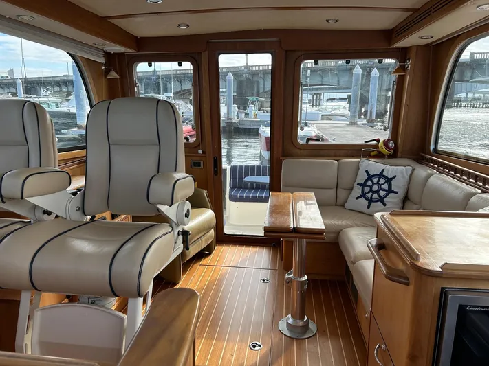 Limbo Yacht Photos Pics Luxurious interior of 2010 Sabre 40 Sedan yacht with leather seating and wood finish.