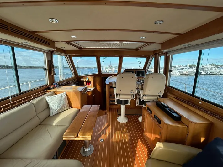 Limbo Yacht Photos Pics Interior of 2010 Sabre 40 Sedan yacht with panoramic windows and elegant wood finish.