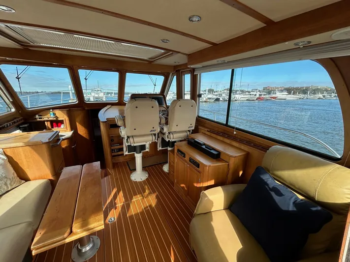 Limbo Yacht Photos Pics Interior of 2010 Sabre 40 Sedan yacht with wooden finish and waterfront view.