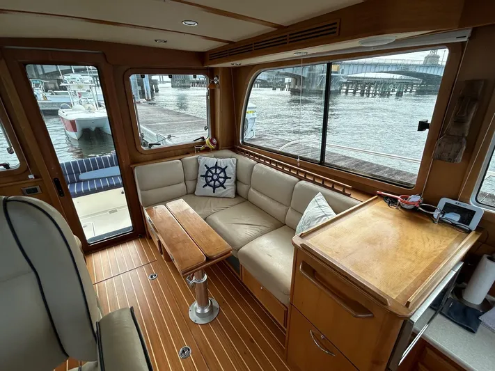 Limbo Yacht Photos Pics Interior of 2010 Sabre 40 Sedan yacht with leather seating and wooden accents.