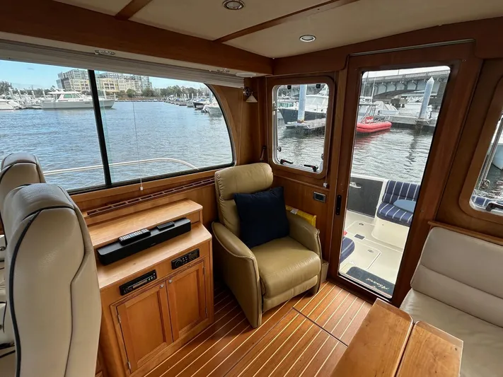 Limbo Yacht Photos Pics Interior of 2010 Sabre 40 Sedan yacht with leather seating and waterfront view.