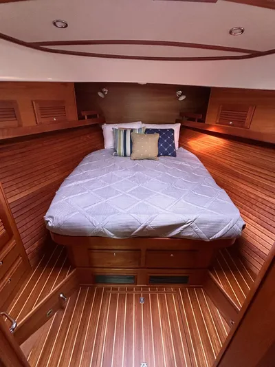 Limbo Yacht Photos Pics Luxurious cabin interior of 2010 Sabre 40 Sedan with cozy bed and wooden finish.