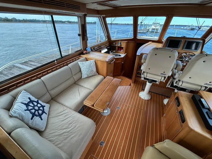 Limbo Yacht Photos Pics Interior of 2010 Sabre 40 Sedan yacht with leather seating and wooden flooring.