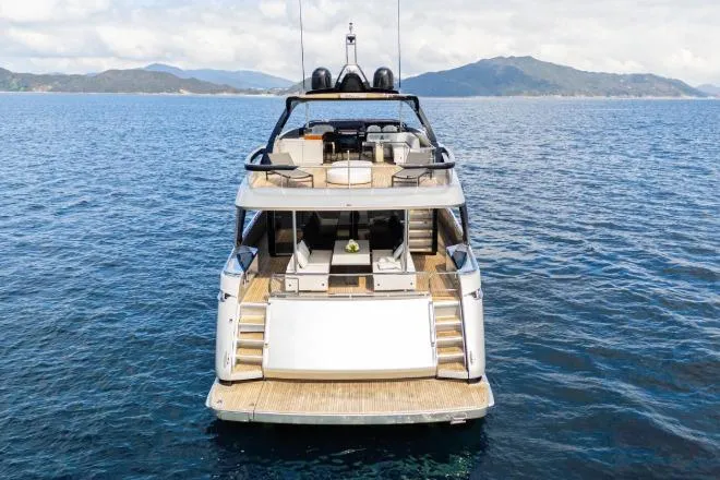  Yacht Photos Pics Luxury 2020 Riva 90 Argo yacht on open sea with scenic mountain backdrop.