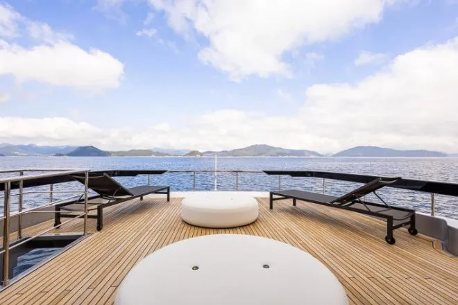  Yacht Photos Pics Luxurious 2020 Riva 90 Argo yacht deck with scenic ocean view and lounge chairs.