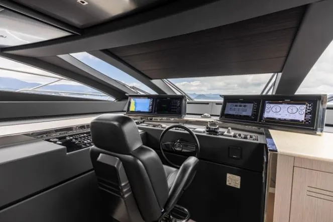  Yacht Photos Pics Cockpit of 2020 Riva 90 Argo yacht with modern navigation displays and leather chair.