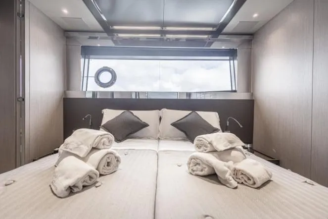  Yacht Photos Pics Luxurious bedroom interior of 2020 Riva 90 Argo yacht with plush bedding and modern design.