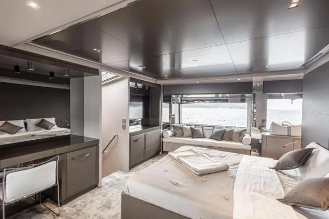  Yacht Photos Pics Luxurious interior of 2020 Riva 90 Argo yacht with elegant bedroom and ocean view.