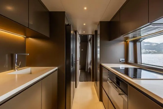  Yacht Photos Pics Luxurious interior of 2020 Riva 90 Argo yacht with modern kitchen design.