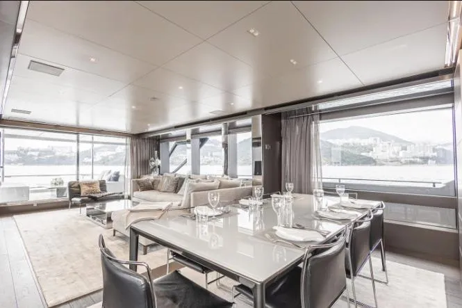 Yacht Photos Pics Luxurious interior of 2020 Riva 90 Argo yacht with elegant dining area and scenic views.