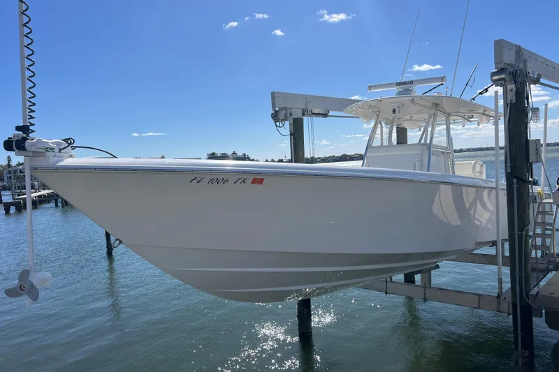  Yacht Photos Pics 2023 Contender 39 ST boat on lift, sunny day, clear blue sky.