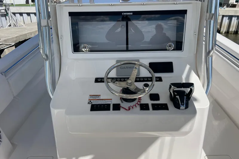  Yacht Photos Pics 2023 Contender 39 ST boat helm with Garmin navigation and steering wheel.