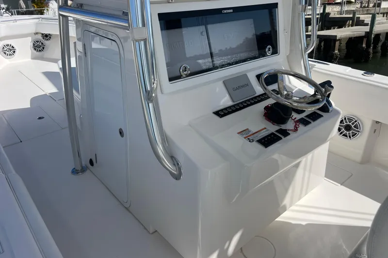 Yacht Photos Pics 2023 Contender 39 ST boat console with Garmin navigation and stainless steel steering wheel.