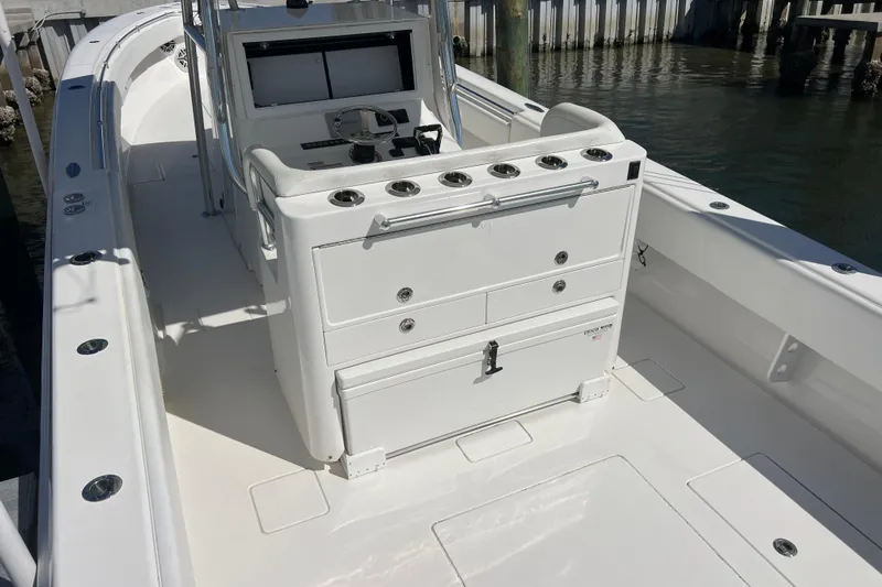  Yacht Photos Pics 2023 Contender 39 ST boat interior with helm station and storage compartments.