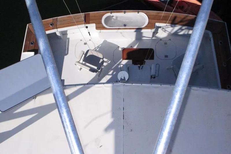 Elska Yacht Photos Pics Aerial view of 1989 Striker 62 boat deck with fishing chair and equipment.