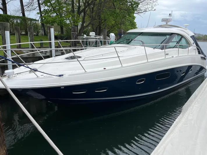 Feeling Nauti Yacht Photos Pics 2011 Sea Ray 470 Sundancer yacht docked, featuring sleek design and modern amenities.