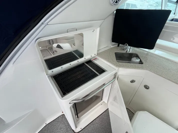 Feeling Nauti Yacht Photos Pics 2011 Sea Ray 470 Sundancer yacht interior with kitchenette and grill.