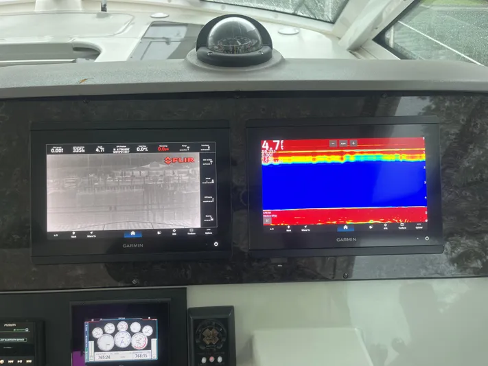 Feeling Nauti Yacht Photos Pics Dashboard of a 2011 Sea Ray 470 Sundancer with Garmin navigation displays.