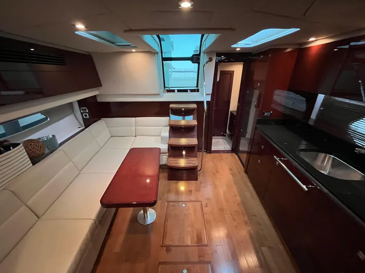 Feeling Nauti Yacht Photos Pics Luxurious interior of 2011 Sea Ray 470 Sundancer yacht with modern furnishings and wood accents.