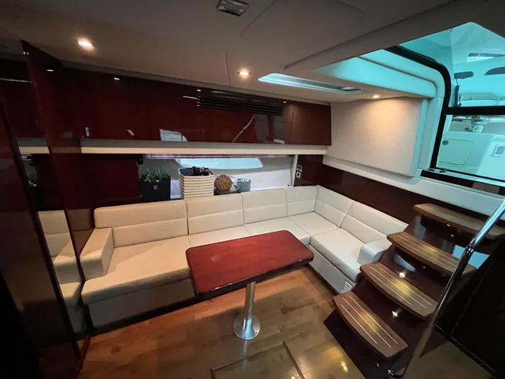 Feeling Nauti Yacht Photos Pics Luxurious interior of 2011 Sea Ray 470 Sundancer yacht with elegant seating and wooden accents.