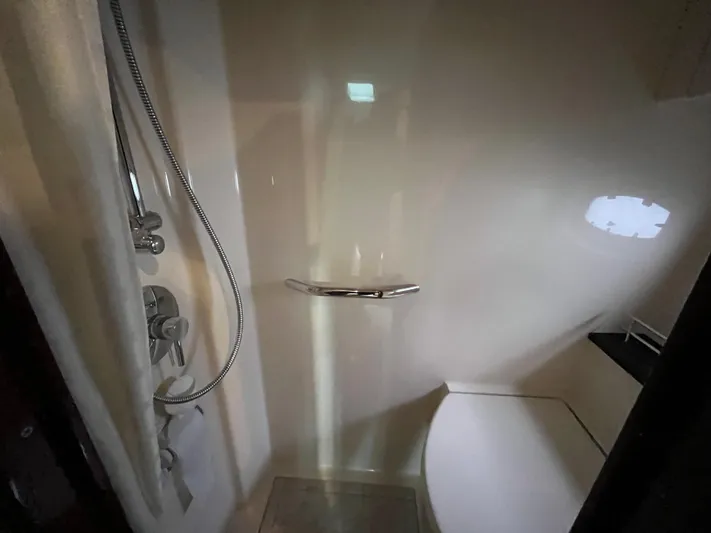 Feeling Nauti Yacht Photos Pics Shower area in 2011 Sea Ray 470 Sundancer yacht, featuring modern fixtures and seating.