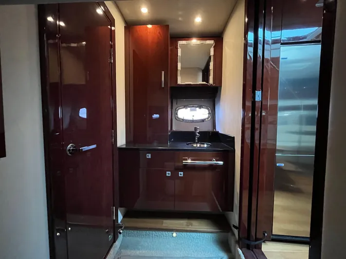 Feeling Nauti Yacht Photos Pics Luxurious interior of 2011 Sea Ray 470 Sundancer yacht with sleek cabinetry and modern fixtures.