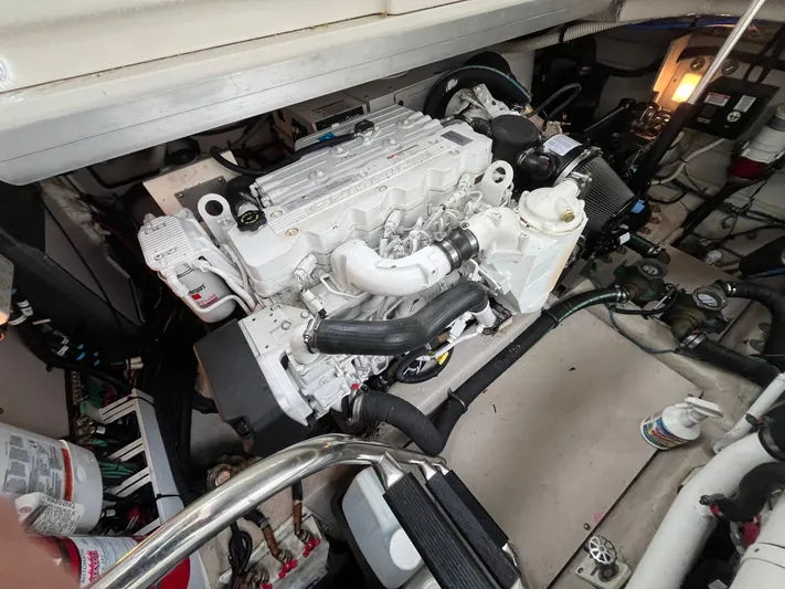 Feeling Nauti Yacht Photos Pics Engine compartment of a 2011 Sea Ray 470 Sundancer, showcasing a clean, well-maintained engine.