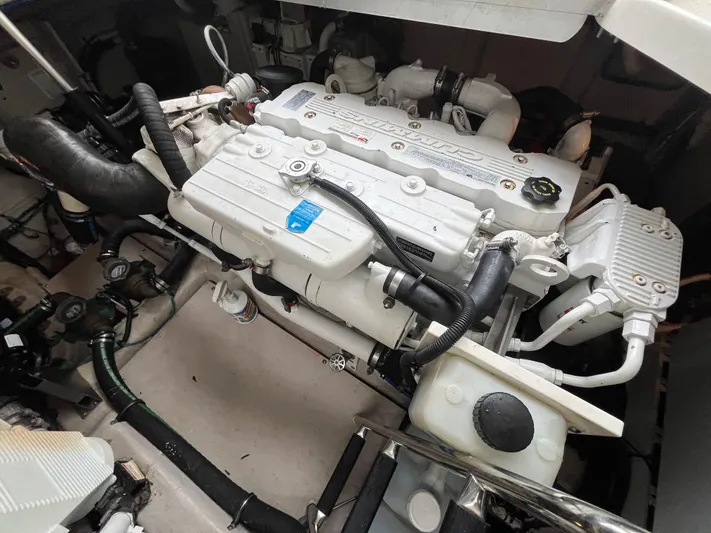 Feeling Nauti Yacht Photos Pics Engine compartment of a 2011 Sea Ray 470 Sundancer boat, showcasing mechanical components.