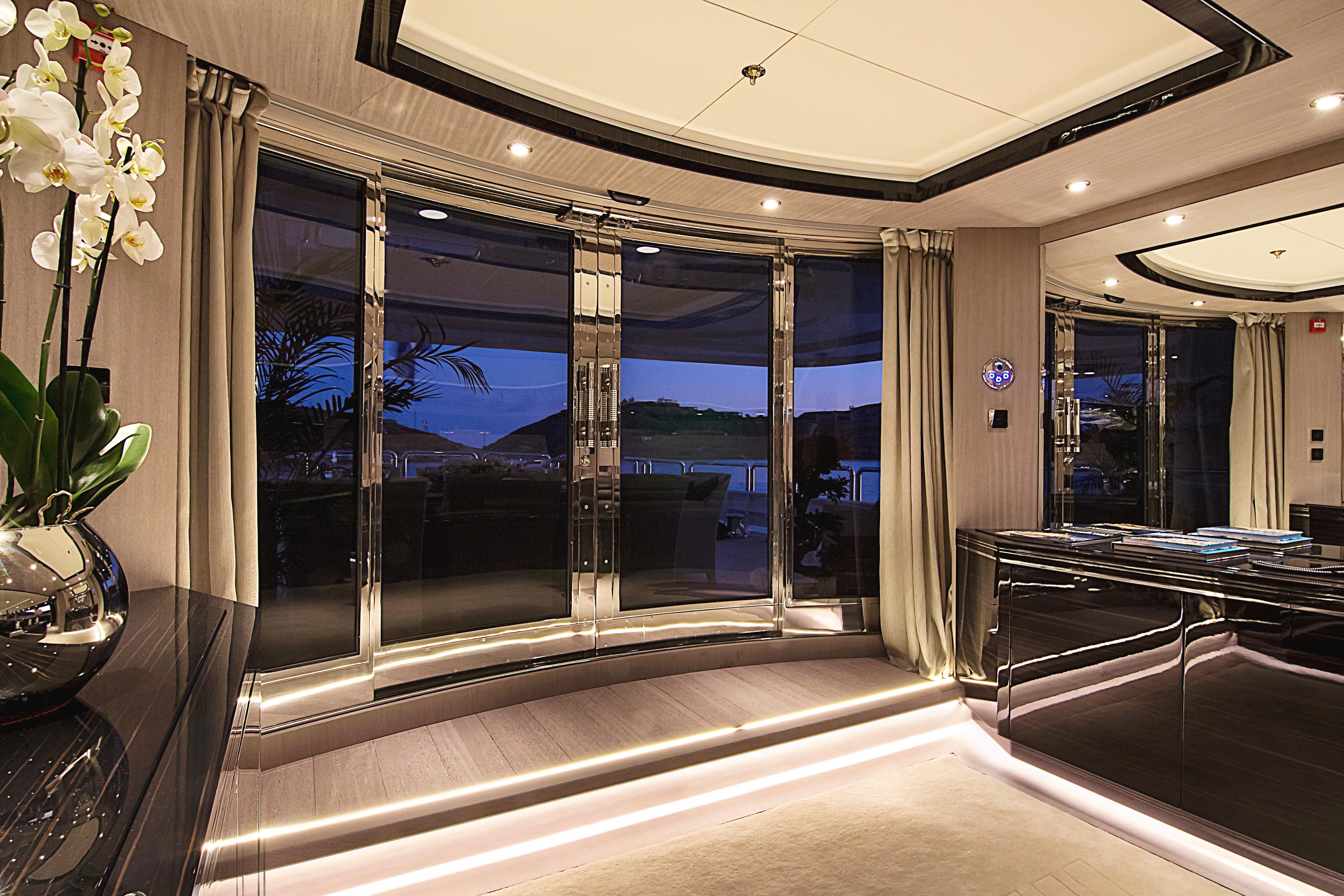 Luxurious interior of 1999 Codecasa 50m Motoryacht with elegant lighting and panoramic windows.