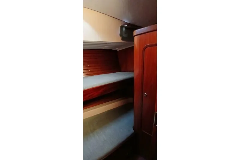 Waterfall II Yacht Photos Pics Interior cabin of 1994 Beneteau Oceanis 44 CC with wooden bunk beds.