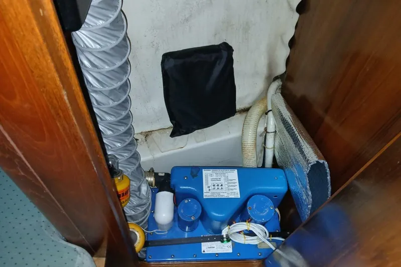 Waterfall II Yacht Photos Pics Engine compartment of a 1994 Beneteau Oceanis 44 CC sailboat, featuring mechanical components.