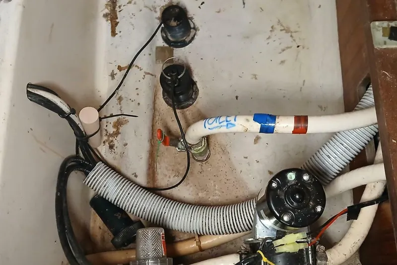 Waterfall II Yacht Photos Pics Bilge area of 1994 Beneteau Oceanis 44 CC with plumbing and wiring components.