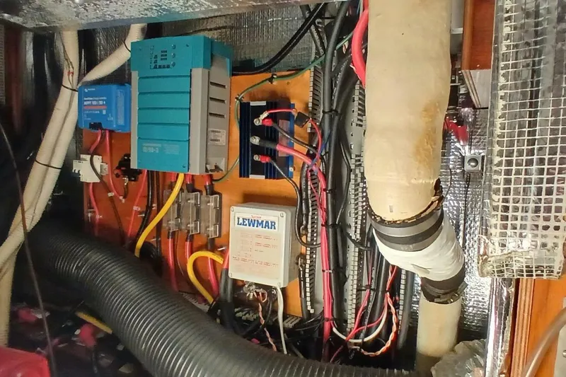 Waterfall II Yacht Photos Pics Electrical system inside a 1994 Beneteau Oceanis 44 CC sailboat, featuring wiring and components.