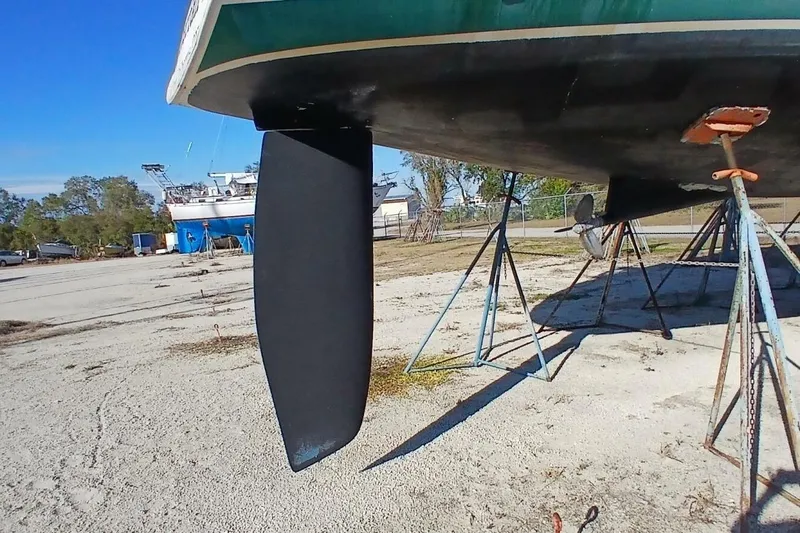 Waterfall II Yacht Photos Pics 1994 Beneteau Oceanis 44 CC sailboat on stands, showcasing keel and hull.