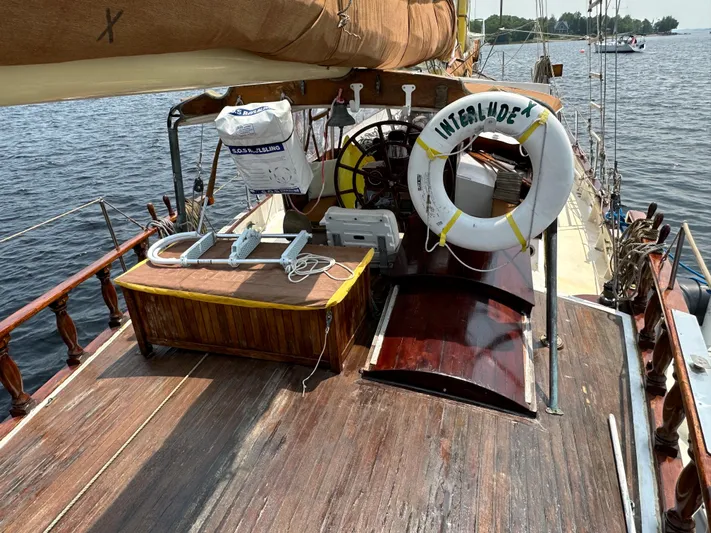 Interlude X Yacht Photos Pics Deck of 1985 Custom Thomas Colvin "Pipistrelle" sailboat with life preserver and equipment.