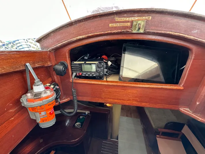 Interlude X Yacht Photos Pics Wooden boat interior with radio equipment, emergency beacon, and storage space, Thomas Colvin "Pipistrelle" 1985.
