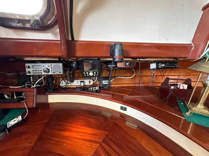 Interlude X Yacht Photos Pics Interior of 1985 Custom Thomas Colvin "Pipistrelle" with navigation equipment and wooden finish.