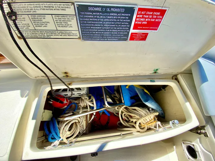 Encore Yacht Photos Pics Storage compartment on a 1998 Pacific Seacraft 37 sailboat, containing ropes and equipment.