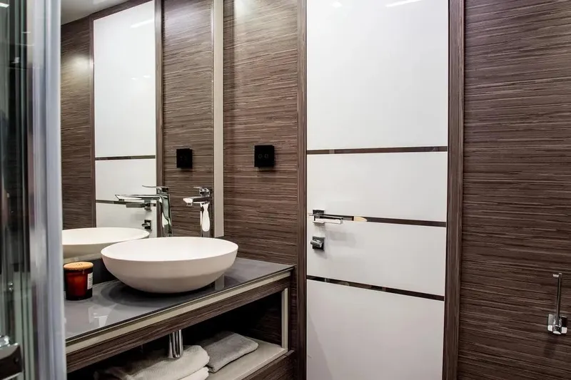  Yacht Photos Pics Modern bathroom interior on 2025 Cobrey 45 FLY yacht, featuring sleek design and vessel sink.