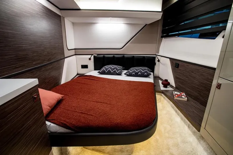  Yacht Photos Pics Luxurious bedroom interior of 2025 Cobrey 45 FLY yacht with modern design and cozy bedding.